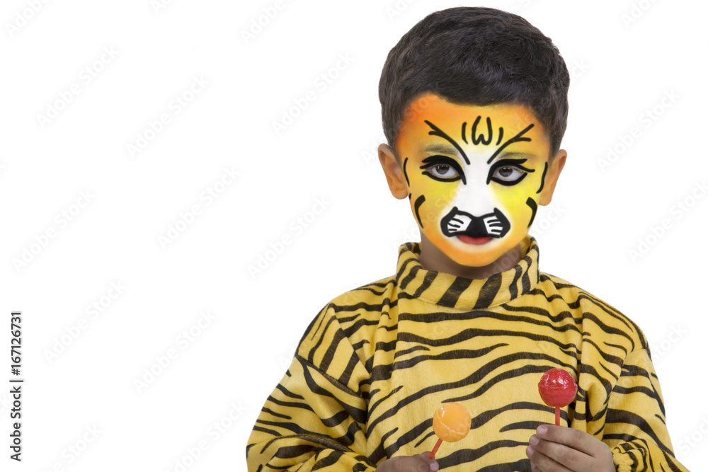 Boy in a tiger costume holding lollipops Boy in a tiger costume holding lollipops