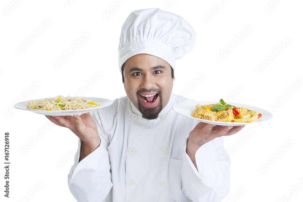 Portrait of chef holding plates with pasta Portrait of chef holding plates with pasta
