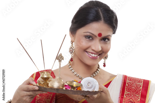 Portrait of a Bengali woman holding a puja thali photo