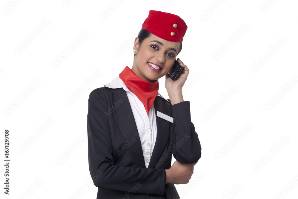Portrait of happy young airhostess on call isolated over white background Portrait of happy young airhostess on call isolated over white background