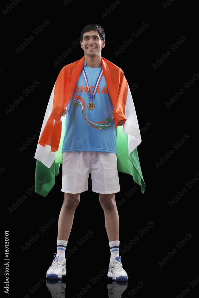 Happy Indian man in sportswear with Indian flag over black background Stock  Photo | Adobe Stock