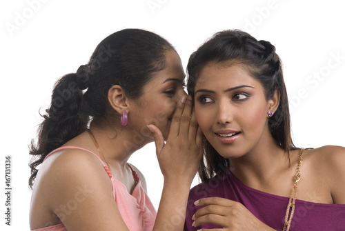 Women whispering 