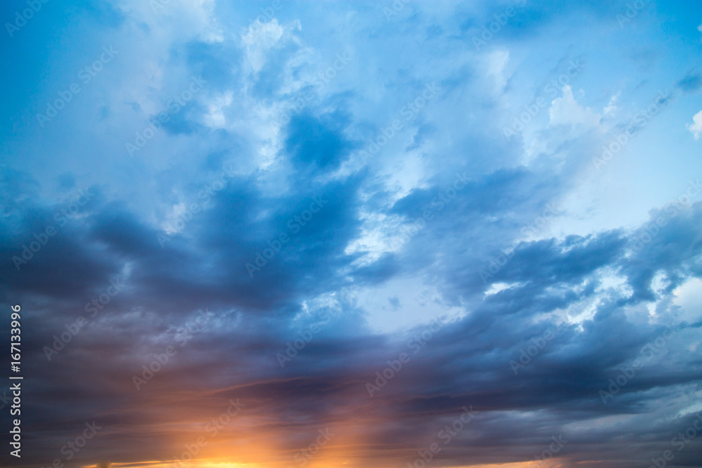 Fototapeta premium Clouds at sunset as background