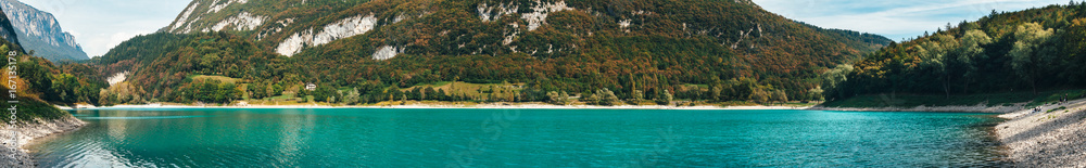 Panorama of Lago di Tenno - lake with turquoise water in Tenno, Trentino, Italy.