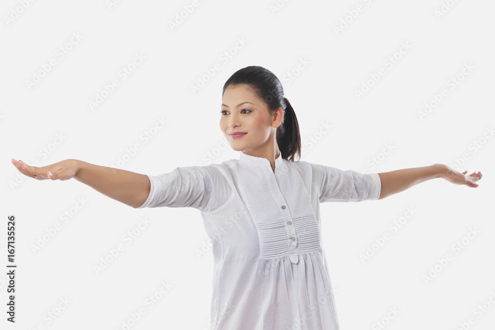 Young smiling woman with arms outstretched Young smiling woman with arms outstretched