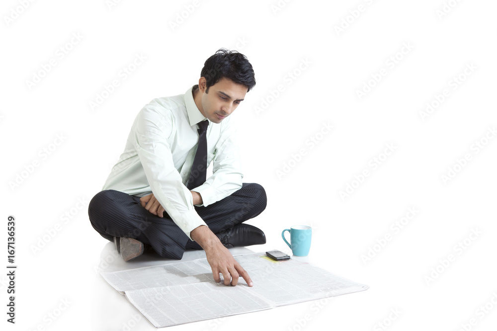Business executive looking for job in newspaper Business executive looking for job in newspaper