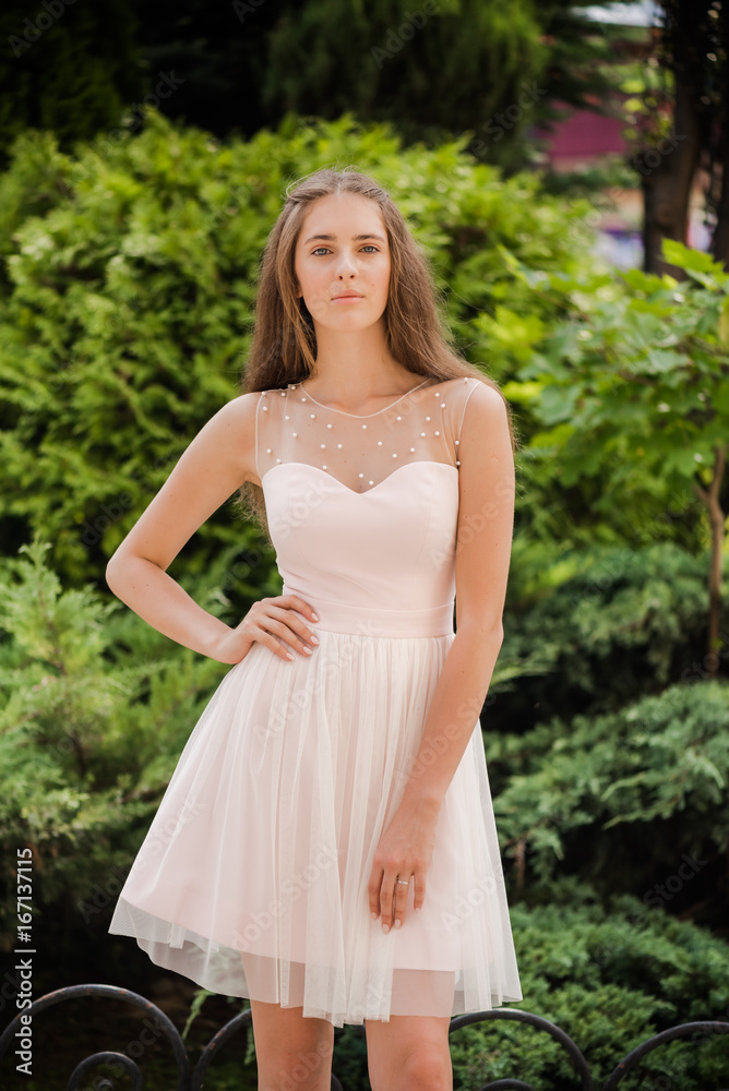 Young beautiful woman in a light summer dress Young beautiful woman in a light summer dress