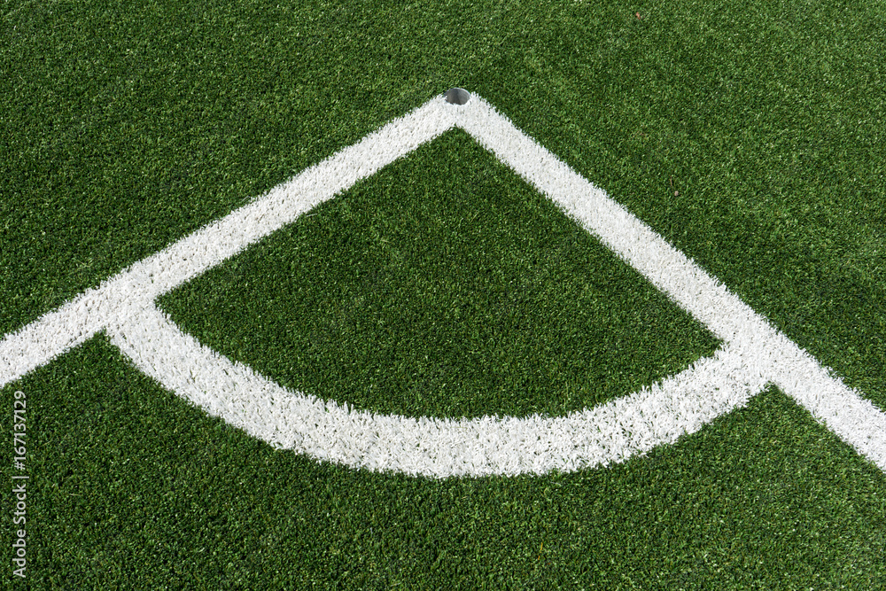 corner lines of football field on plastic green