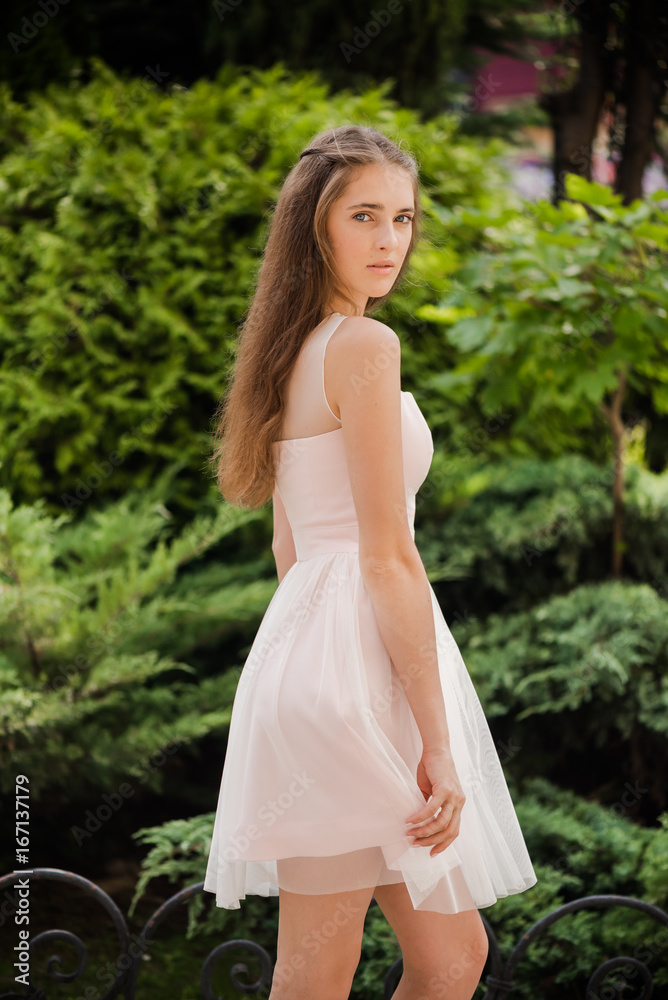 Young beautiful woman in a light summer dress Young beautiful woman in a light summer dress