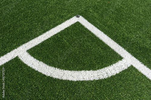 corner lines of football field on plastic green