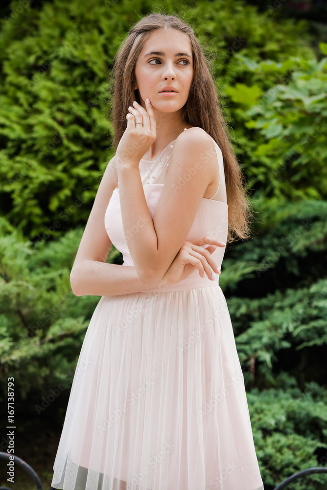 Young beautiful woman in a light summer dress Young beautiful woman in a light summer dress