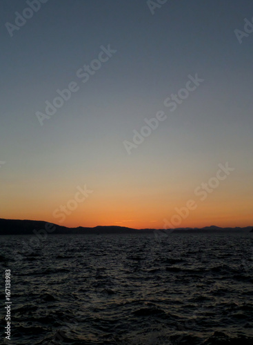 Orange color sunset afterglow on deep blue sky over the North Sea in Bergen, Norway
