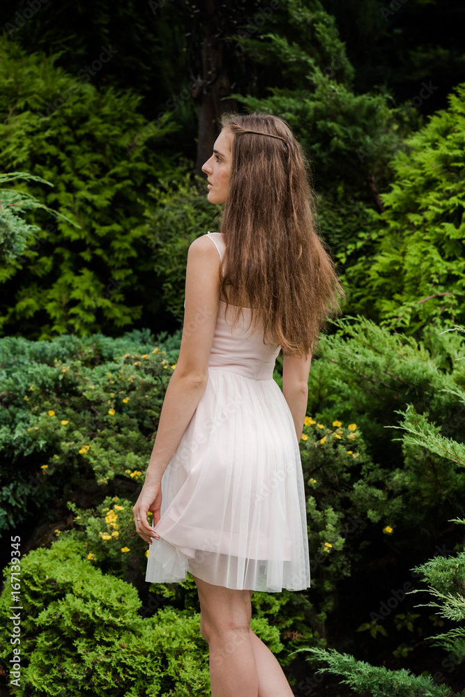 Young beautiful woman in a light summer dress Young beautiful woman in a light summer dress