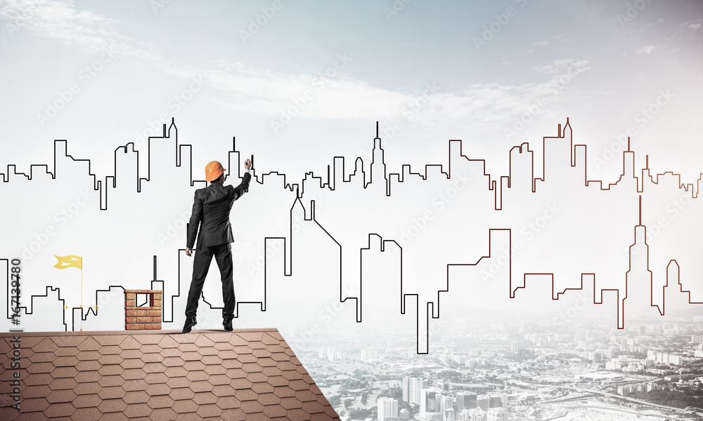 Man architect draw silhouette of modern city on blue sky. Mixed Man architect draw silhouette of modern city on blue sky. Mixed