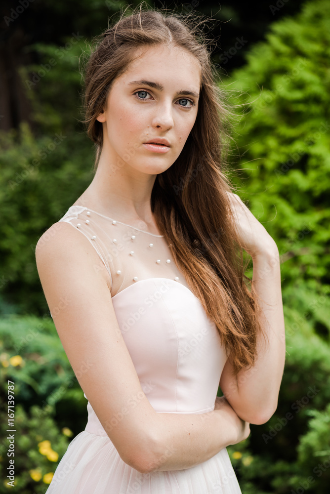 Young beautiful woman in a light summer dress Young beautiful woman in a light summer dress