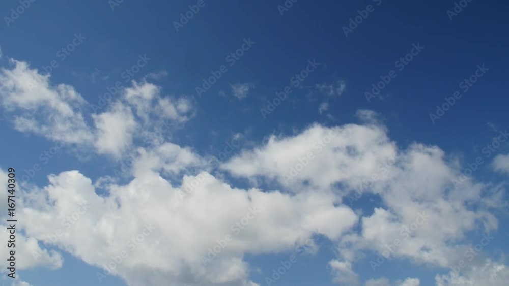Time lapse clip of white fluffy clouds over blue sky. Copy space. Time lapse clip of white fluffy clouds over blue sky. Copy space.