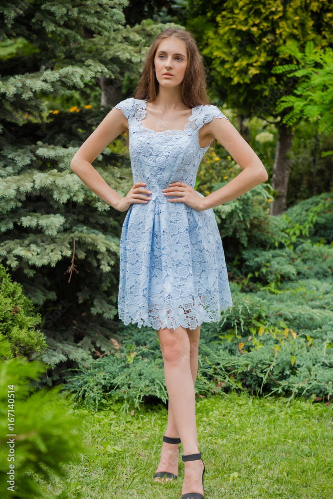 Young beautiful woman in a light summer dress Young beautiful woman in a light summer dress