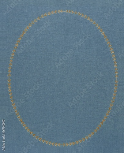 Fabric background with gold embossed oval frame