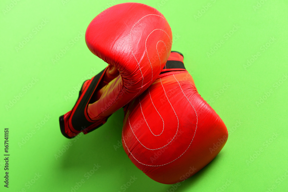 Bright red sports gloves for boxing with stripes