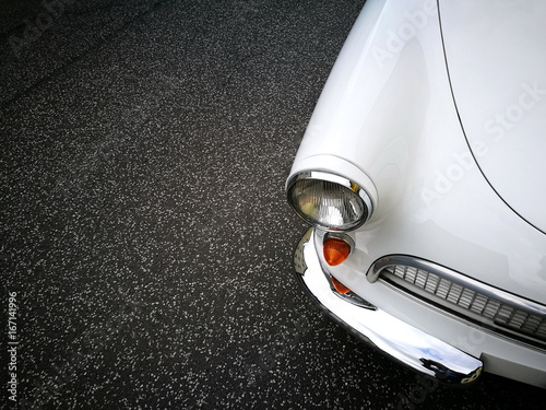 Schneeweißer offener Sportwagen mit Dreizylinder Zweitaktmotor der Fünfzigerjahre und Sechzigerjahre auf grauem Asphalt bei den Golden Oldies in Wettenberg Krofdorf-Gleiberg bei Gießen in Hessen photo