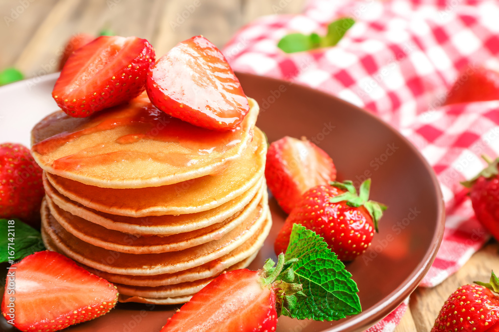 Plate with delicious pancakes on table Plate with delicious pancakes on table