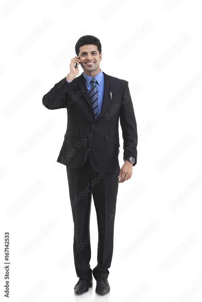 Portrait of businessman talking on a mobile phone Portrait of businessman talking on a mobile phone