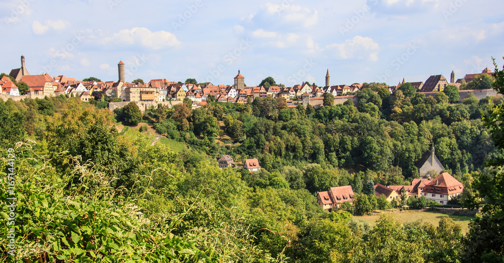 Rothenburg ob der Tauber Old town, wall and church hidden in the forest, Rothenburg ob der Tauber, Germany. One of the most famous attractions in Romantic Road Driving Destination.