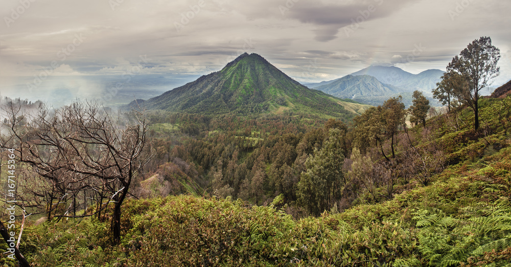 Panoramic view of the volcano and wooded hills, Indonesia Panoramic view of the volcano and wooded hills, Indonesia