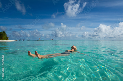 Cute woman relaxing on the tropical beach © gawriloff