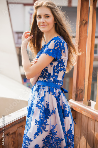 Portrait of beautiful young woman wearing in a dress