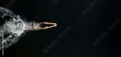 Young female swimming underwater