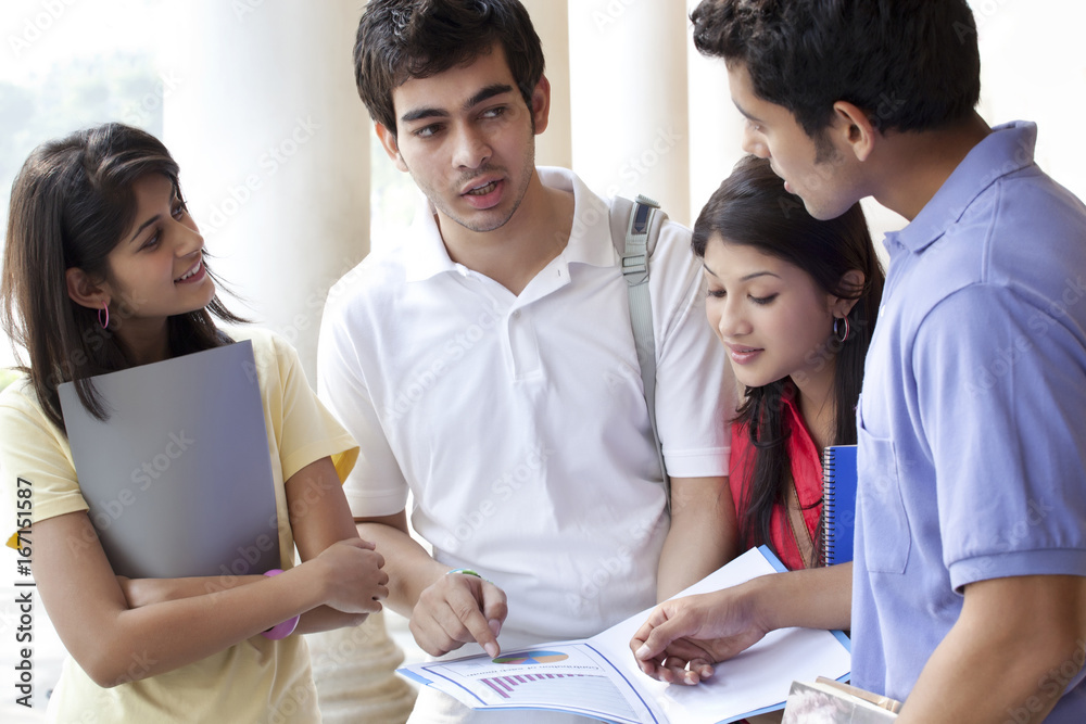 Group of students studying together bon a project Group of students studying together bon a project