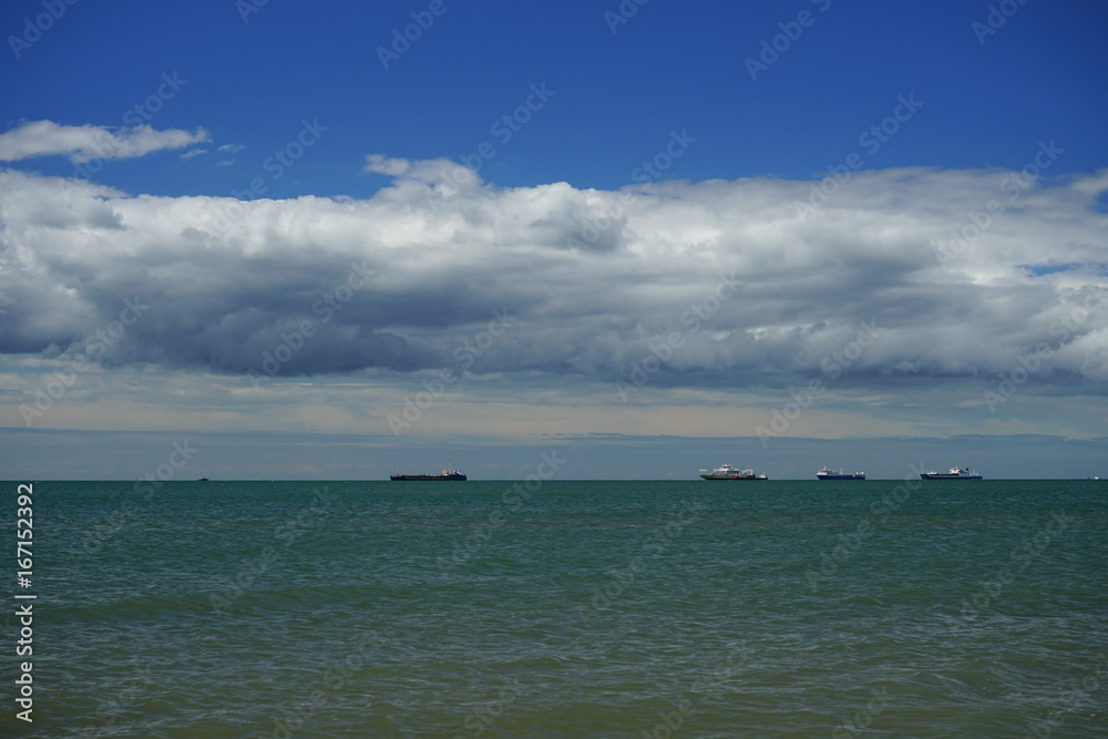 the sea in the Kerch Strait with the Azov sea waves on the background of blue sky the sea in the Kerch Strait with the Azov sea waves on the background of blue sky