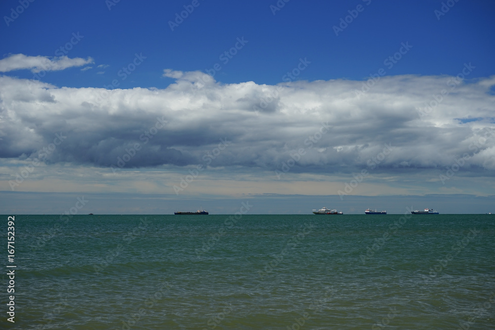 the sea in the Kerch Strait with the Azov sea waves on the background of blue sky