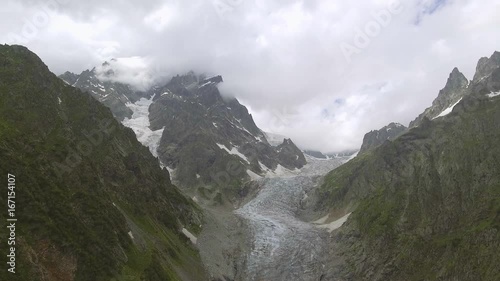 Wallpaper Mural Flying over Glacier valley in svaneti Rocks. Snow peak in Caucasus, Georgia. Torontodigital.ca