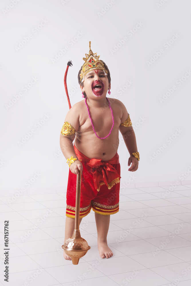 Full length of boy dressed as God Hanuman screaming at home Stock Photo |  Adobe Stock