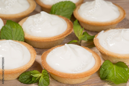 Tartlets with a gentle curd cream on the table