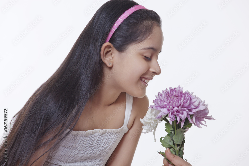 Little girl smelling flowers Little girl smelling flowers