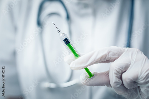 Syringe, medical injection in hand. Vaccination equipment.