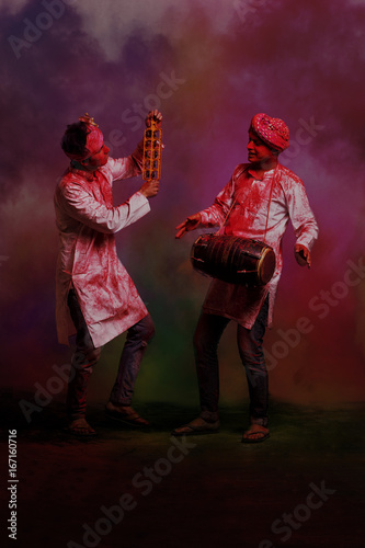 Photography Two Young Indian men With Colored Face Dancing During Holi Color festival