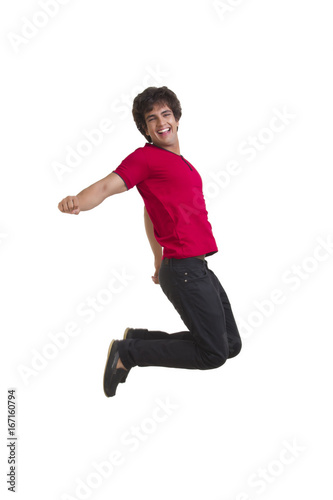 Full length of excited young man jumping isolated over white background © IndiaPix