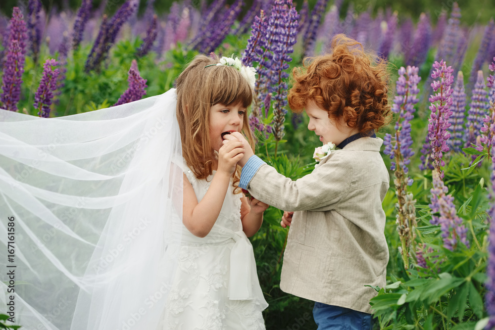 Fototapeta premium two funny little bride and groom