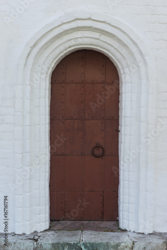 Old metal black doors with round handles © Stanislav Ostranitsa