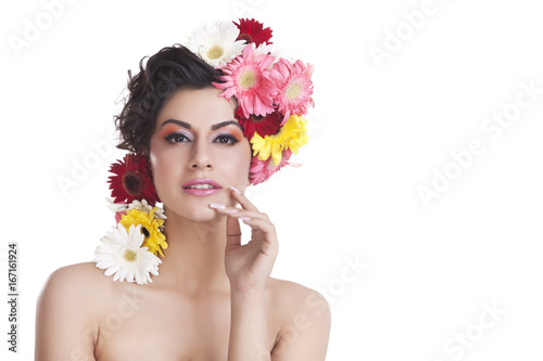 Portrait of a beautiful woman with flowers in hair