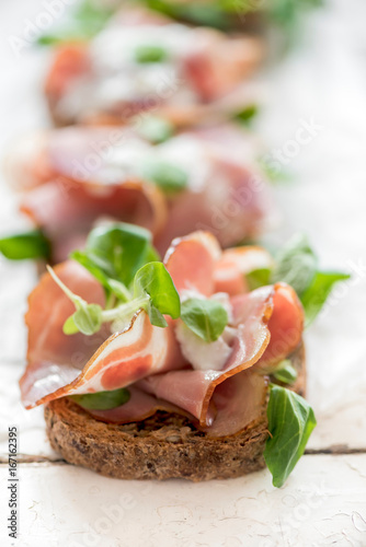 Toast sandwich with Italian prosciutto and cream cheese,selective focus