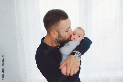 young happy father with cute baby 