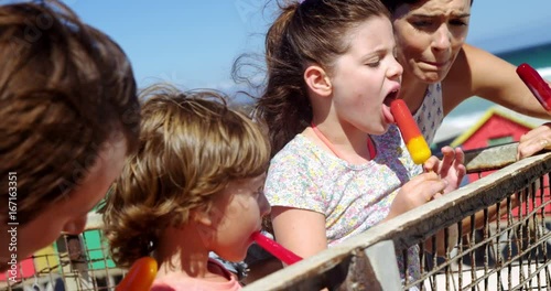 Family having ice cream at beach