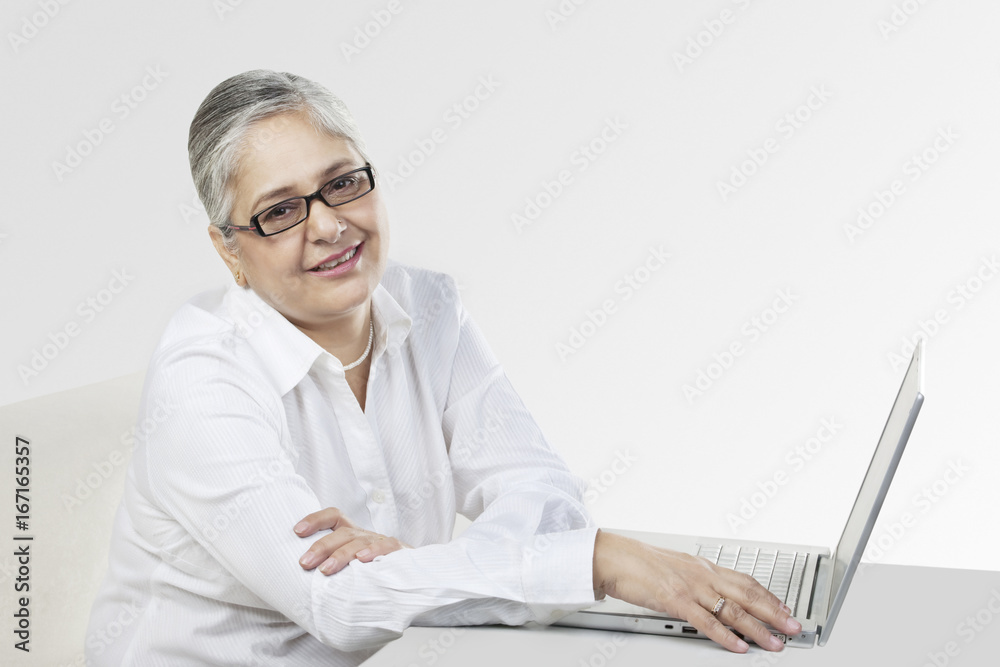 Old woman with a laptop Old woman with a laptop