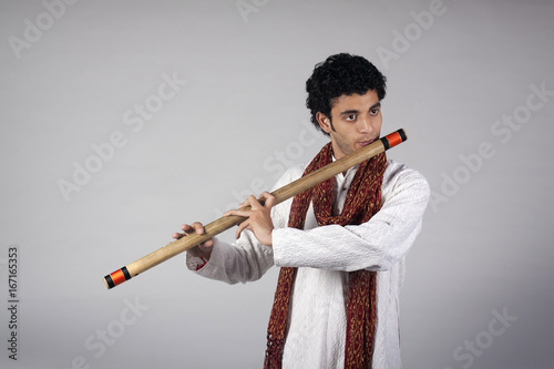 Man playing the flute  photo