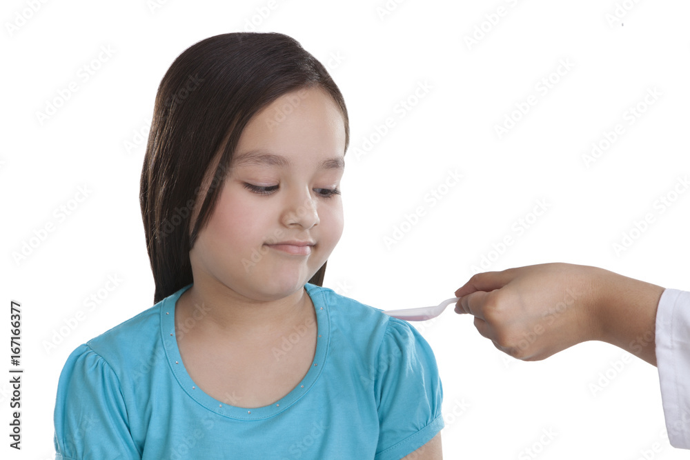 Little girl having medicine Little girl having medicine